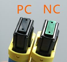 Arrayed Fiberoptics NC-MPO Connector on Right Traditional PC-MPO on left for comparison Note visible AR coating on NC-MPO