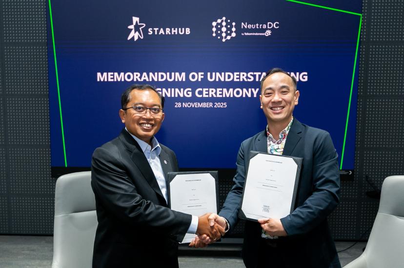 StarHub and NeutraDC executives shaking hands at the signing ceremony for a Memorandum of Understanding