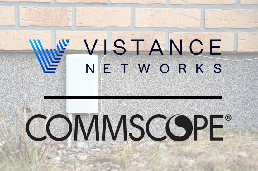 White ftth box on grey wall. Installation of fibre optic internet outside of the building.