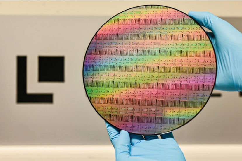 A high-resolution view of a 200mm silicon-on-insulator (SOI) wafer featuring photonic integrated circuits, developed through the Ligentec X-Fab photonics partnership for TFLN scaling