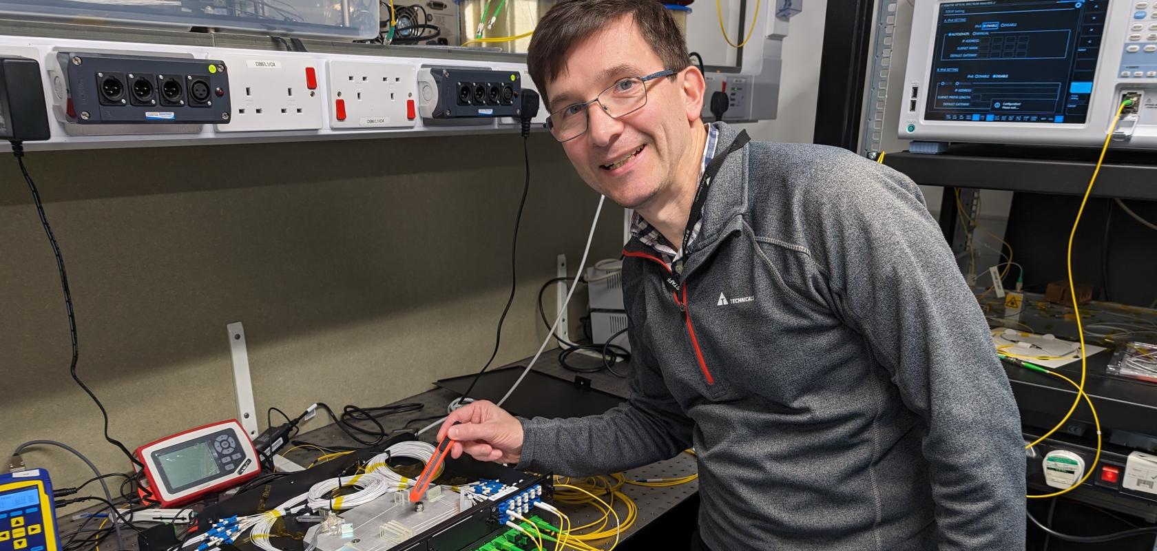 Dr Ian Phillips with the wavelength management device