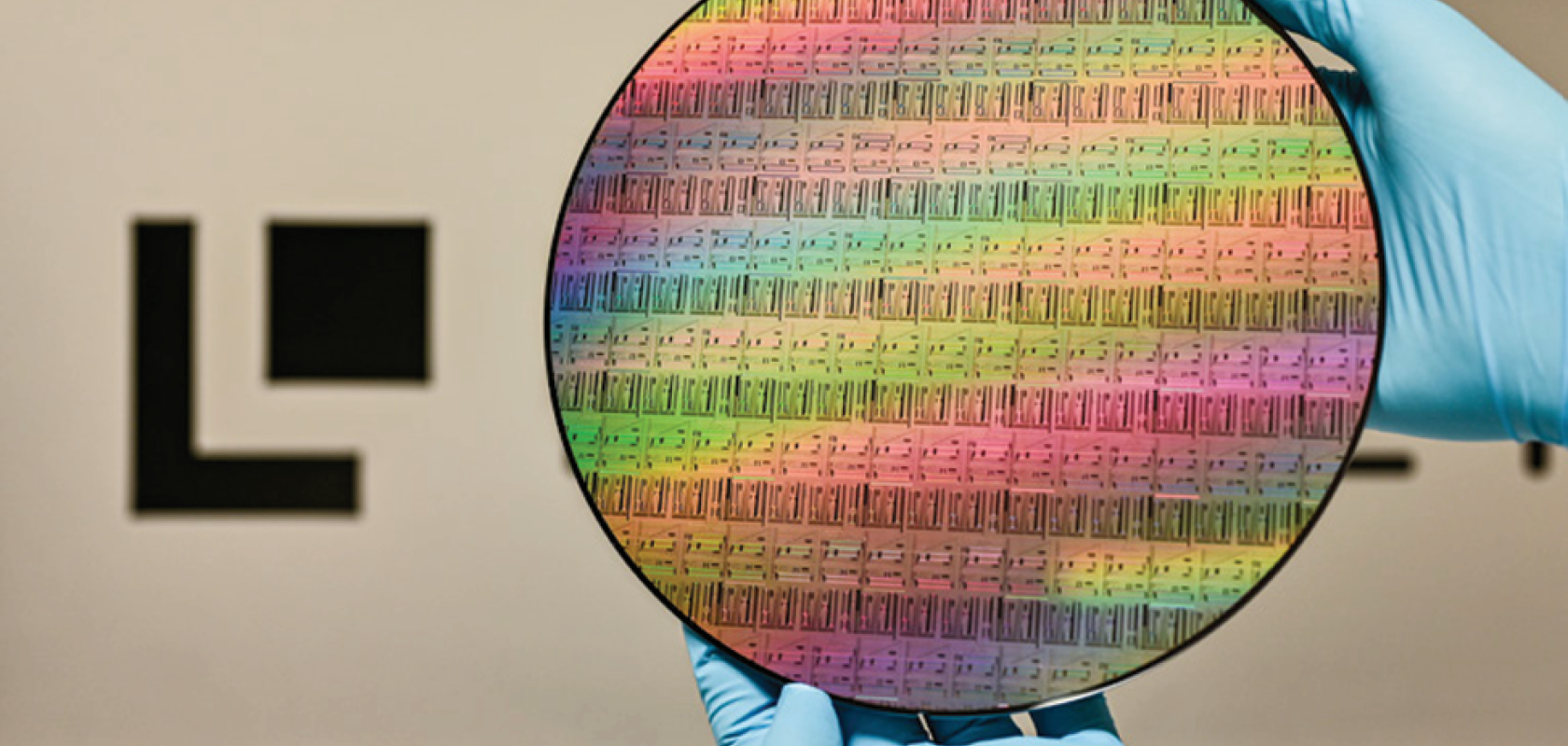 A high-resolution view of a 200mm silicon-on-insulator (SOI) wafer featuring photonic integrated circuits, developed through the Ligentec X-Fab photonics partnership for TFLN scaling