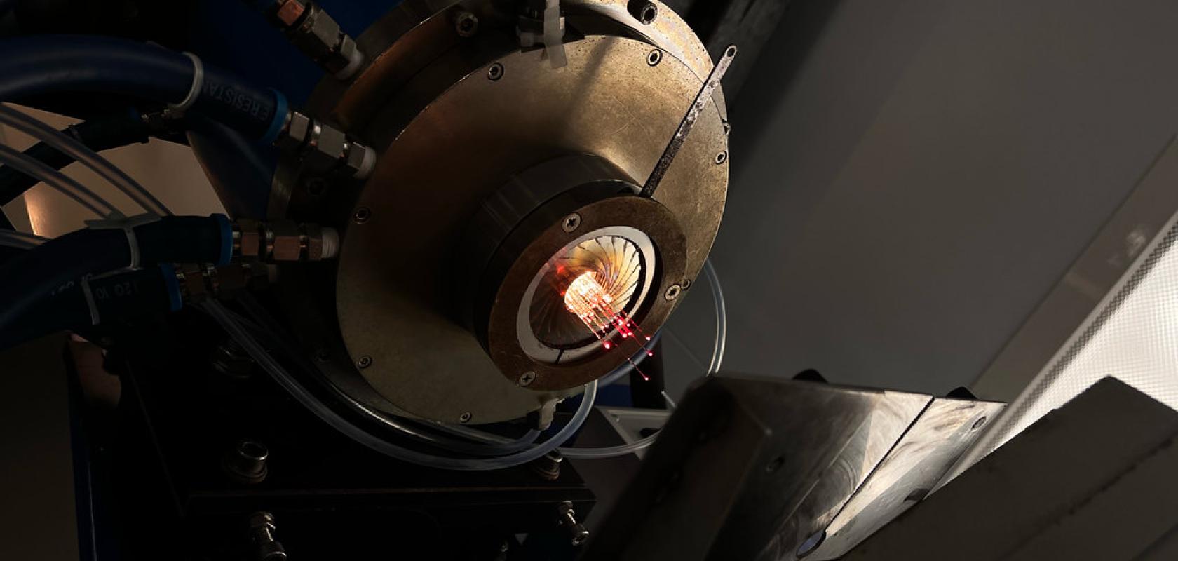 Emerging from the 2000 degree C furnace, a fibre 'stack' guides light - multicore fibre